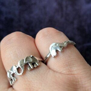 Two silver tone contemporary rings with elephants
